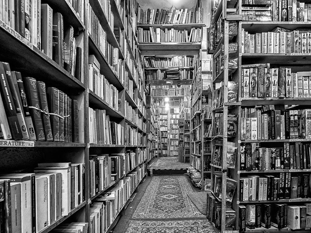 Bookshelves. CC BY-NC-SA 2.0 via https://flickr.com/photos/graeme_pow/46566258622/